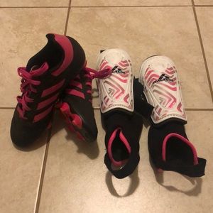 Girls pink soccer cleats and shin guards
